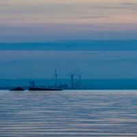 Broken section of Mulberry Harbour at dusk.