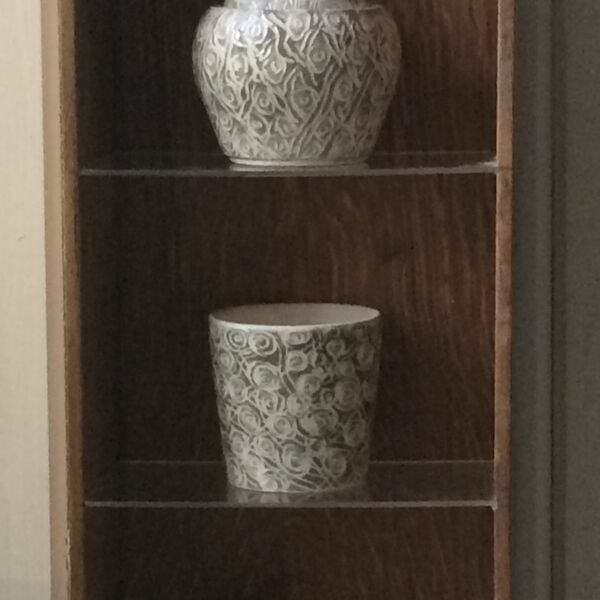 Small Acorn Storage Jar and 2 Espresso Cups in an Oak Cabinet
