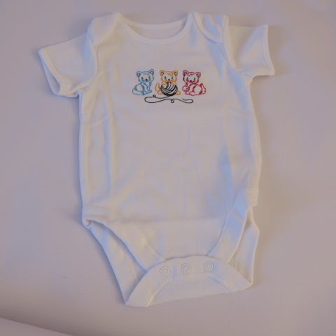 Embroidered baby grow with trio of playful kittens