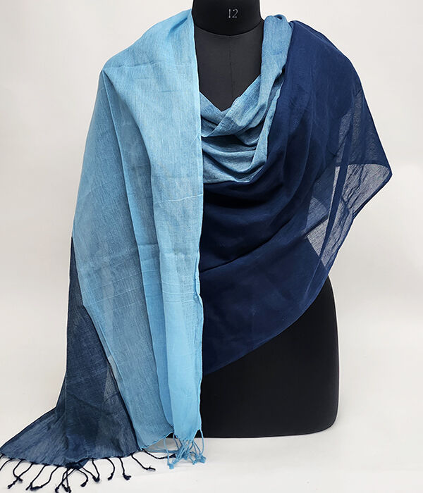 Dark and pale blue fine cotton scarf draped on a mannequin