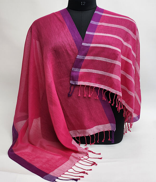 fuschia pink fine cotton scarf draped on a mannequin