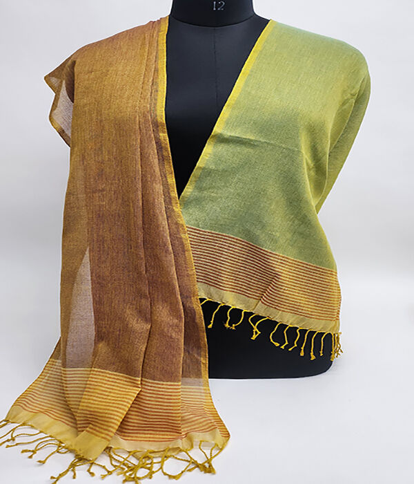 Tan and brown and green fine cotton scarf draped over a mannequin