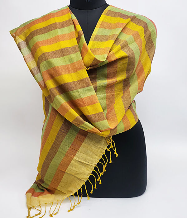 Orange and rust and green striped scarf draped across a Mannequin