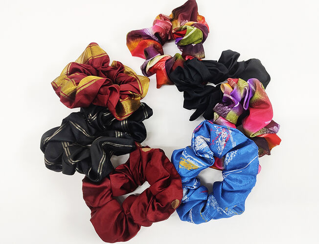 Assorted coloured hair scrunchies made of tailor's waste