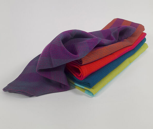 Striped tea towels folded and stacked