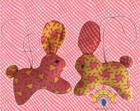 Bunny Ornament Two cotton soft toy bunnies with a cord to hang as a decoration. One