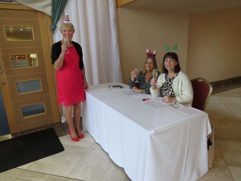 The Elves (and our version of Santa) waiting to check us all in