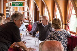 Lynn (the caterer) pointing out something to David Hocken & Dilys Ellerton
