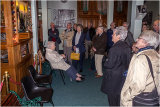 Everyone listening to another of the organs playing, with Midge Tessier in front of it