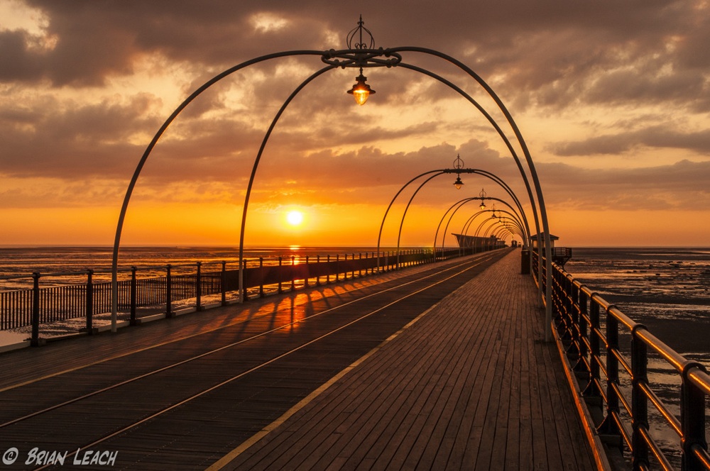 Sun Setting Over The Pier