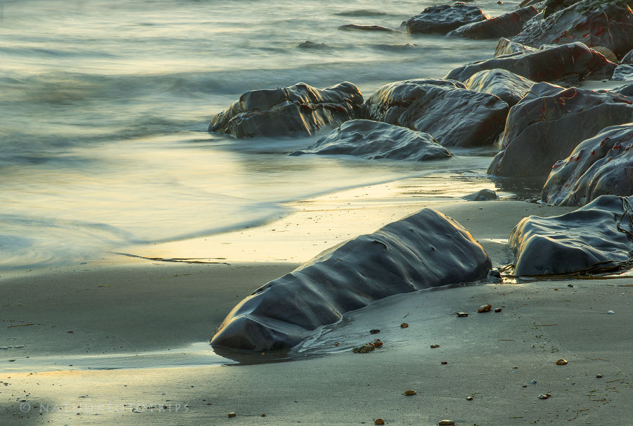 Zonsondergang aan zee