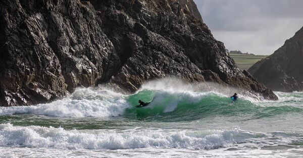 Surfing Kynance Cove