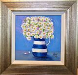 Daisies in striped jug