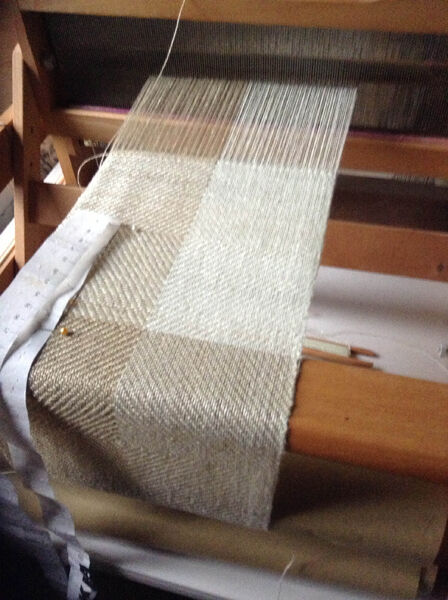 4 shaft table loom threaded with linen