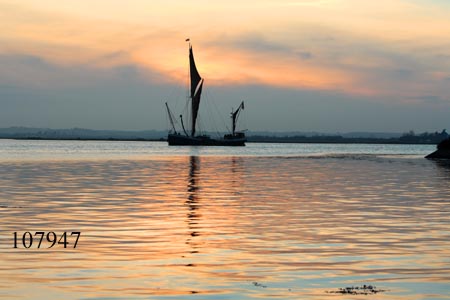 Sailing barge at twilight