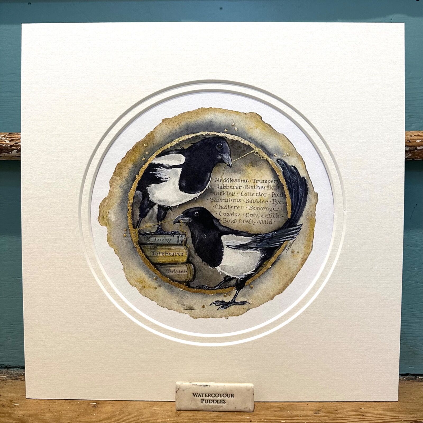 circular image of magpies