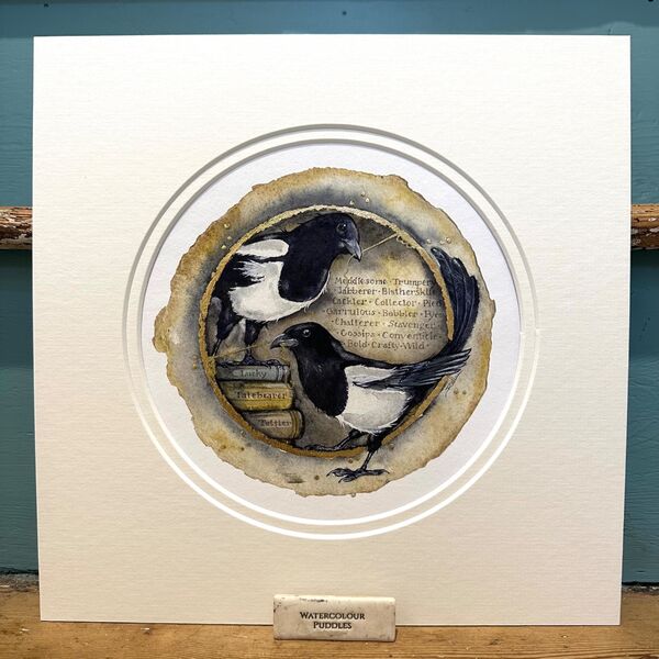 circular image of magpies