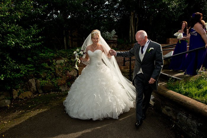 Portrait And Wedding Photographer Cheshire Chester Father Leads Father Leads Bride Up The Churchyard Path Richard Linnett Photography