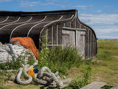 Upturned fishing boat shed