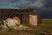 Upturned fishing boat shed