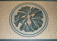 Green man mosaic commission by Sue Kershaw, mosaic artist