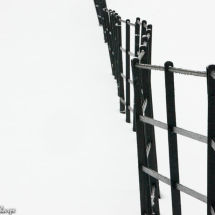 Black fence in snow