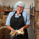 A happy bakery employee portrait photography by Thousand Word Media