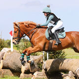 A young showjumper mid air on a beautiful chesnut horse equestrian photography by Thousand Word Media Gloucestershire