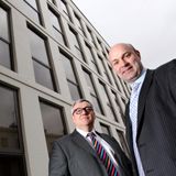 Portrait of management outside their office building, business corporate photography by Thousand Word Media Gloucestershire.