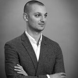 Monochrome portrait of a young CEO, arms folded, branding photography by Thousand Word Media