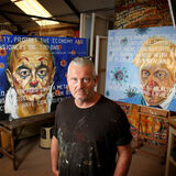 Artist Russell Haines in his studio with painting Gloucester editorial portrait photography by Thousand Word Media Gloucestershire