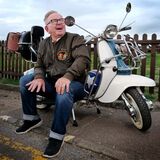 An older scooter enthusiast with his Lambretta Cheltenham editorial portrait photography by Thousand Word Media Gloucestershire