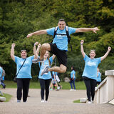 An Alzheimer's Society charity walker leaps for fun event photography by Thousand Word Media Gloucestershire