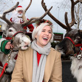 Merry Christmas! A smiling young woman with two reindeers Tewkesbury corporate PR photography by Thousand Word Media Gloucestershire.