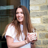 A young woman takes a tea break corporate portrait photography by Thousand Word Media Gloucestershire