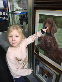 This is Bev and Gary's Granddaughter at Crufts with their painting .. ahh!