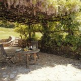 The Easthouse patio with shade from the wisteria pergola