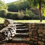 Stone steps round the mill leat