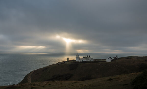 Sunbeams over Anvil Point lighthouse
