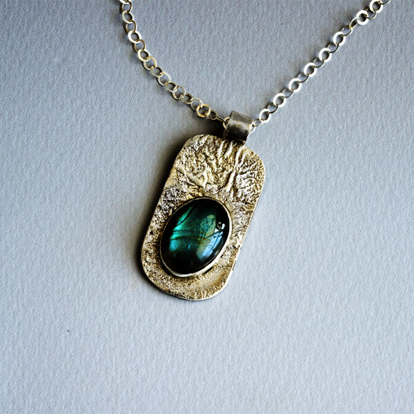 N18007 - Laboradite stone on reticulated silver pendant.