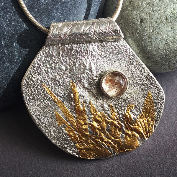N19001- Silver, gold & rutilated quartz pendant