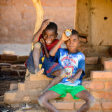 Playing by the road side