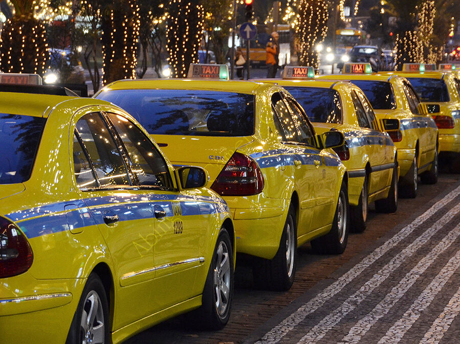 Taxis under festive lights
