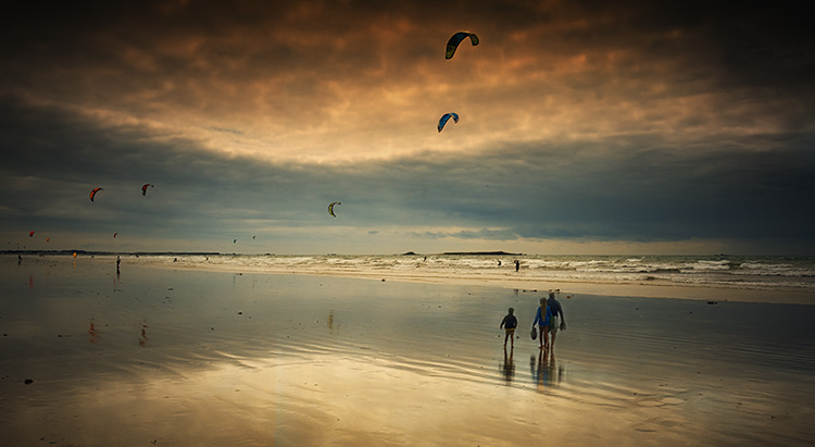 Kite surfing and beach scene