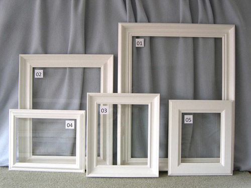 FIVE WHITE-PRIMED FRAMES