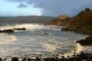 Waves crash against shore at Culzean