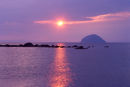 Ailsa Craig with sun setting behind it