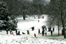 Snow in Eglington Park Irvine brought out the people to enjoy the park making the painting similar to a Lowry painting