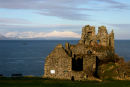 Dunure CAstle with snow covered Arran in background