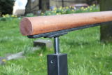 Steel Handrail with hardwood top.